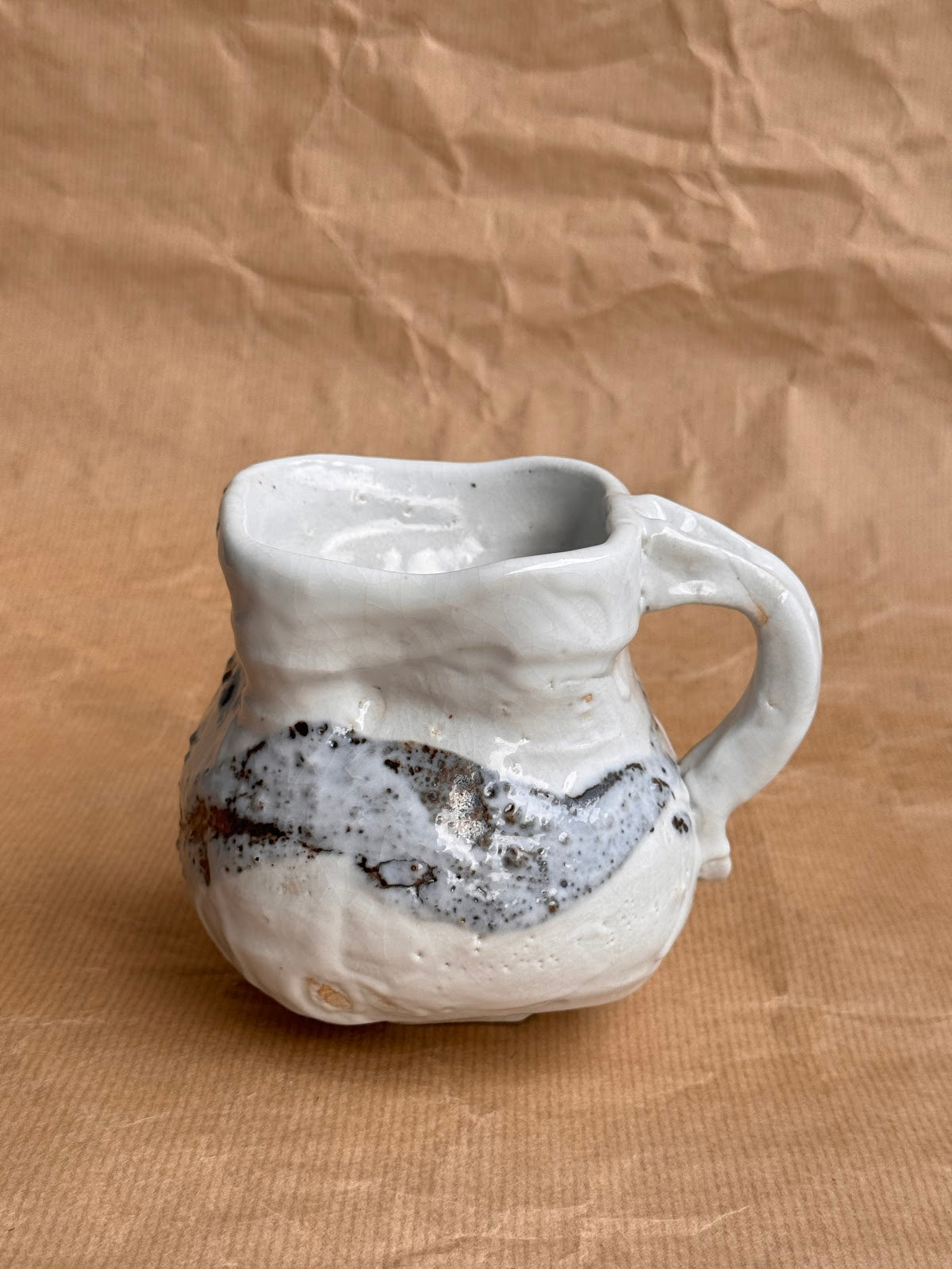 Shino mug with iron stone speckles