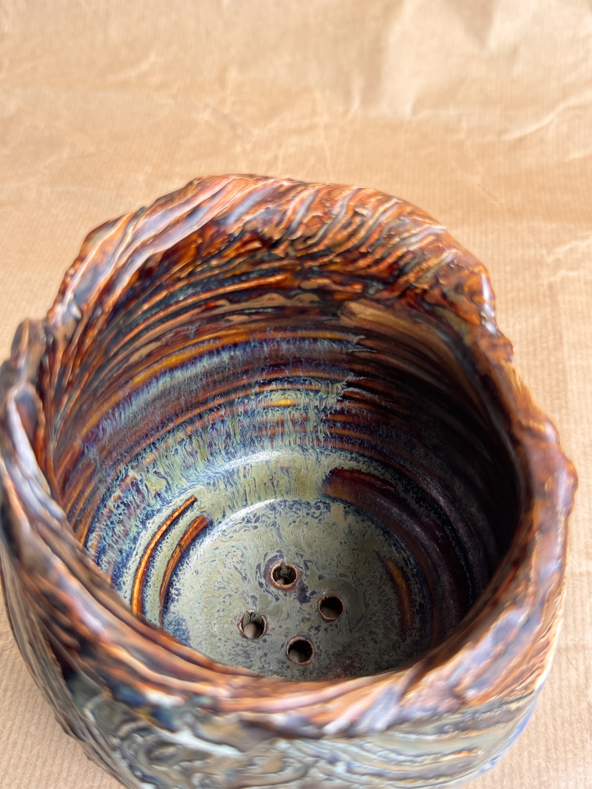 Stoneware planter, top view showing drainage