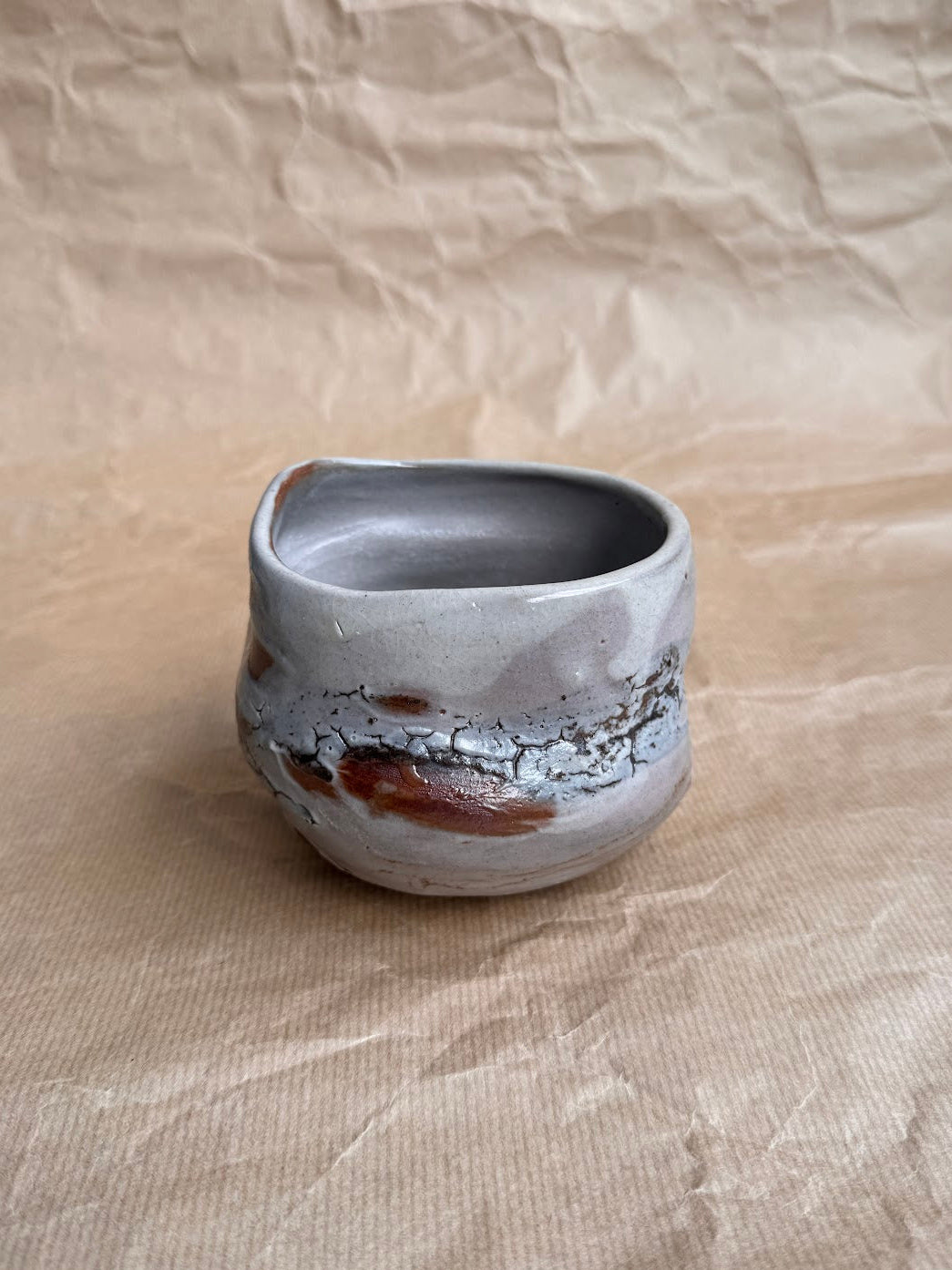 Shino chawan with iron stone speckles