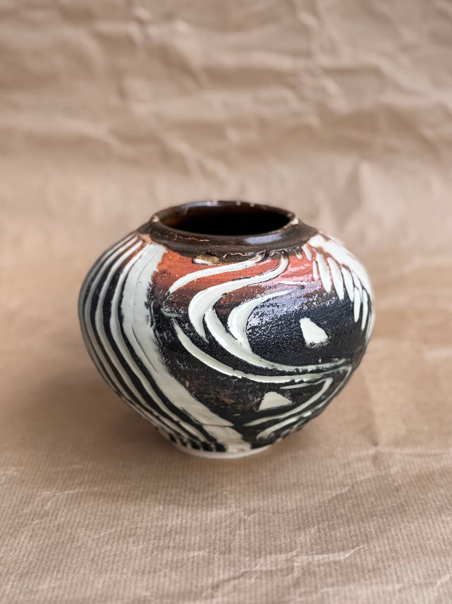 Altered stoneware vase with slip surface