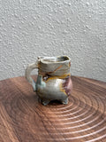 Woodfired stoneware mug with heavy ash deposit and flame markings, Bali