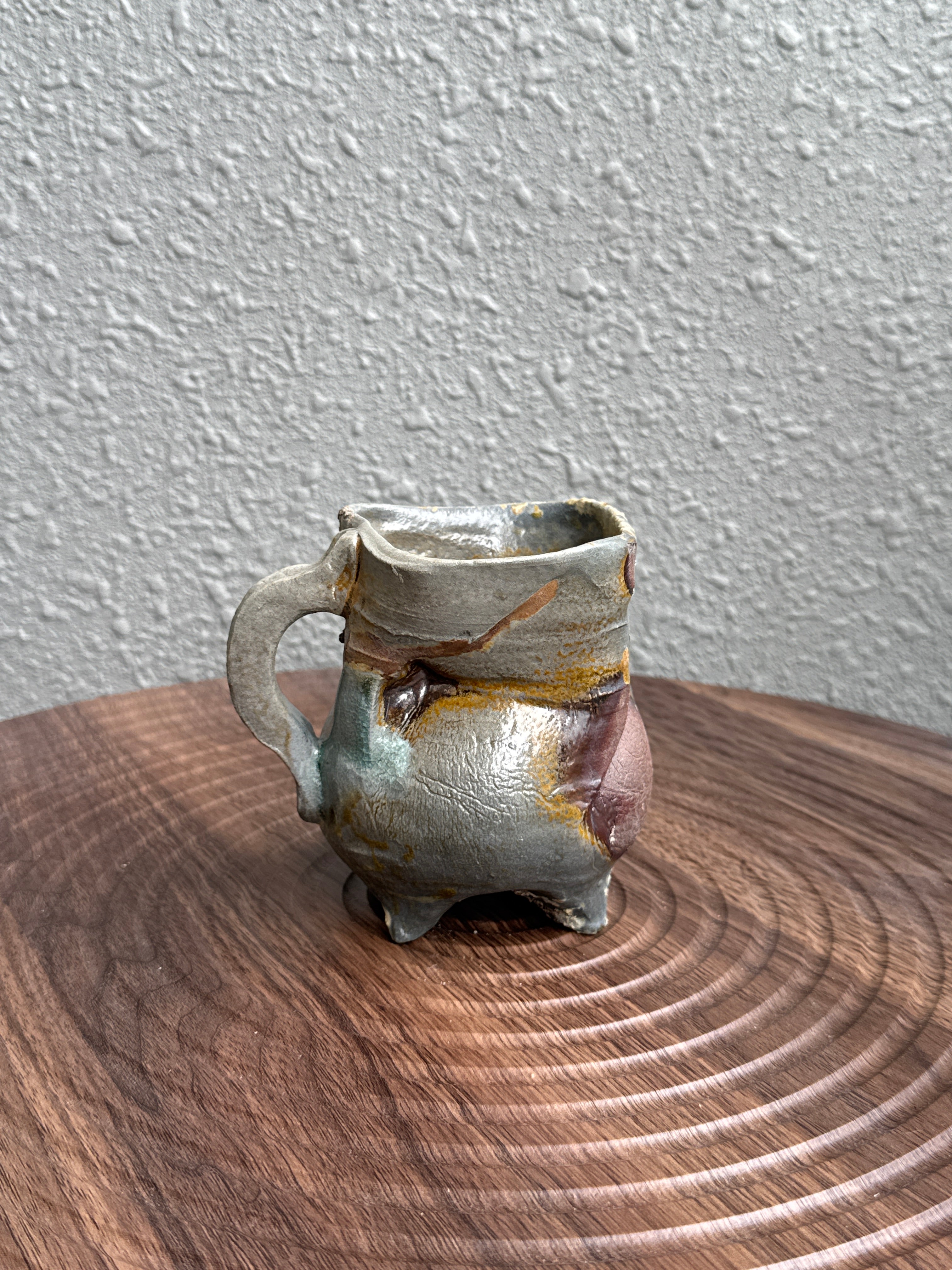 Woodfired stoneware mug with heavy ash deposit and flame markings, Bali