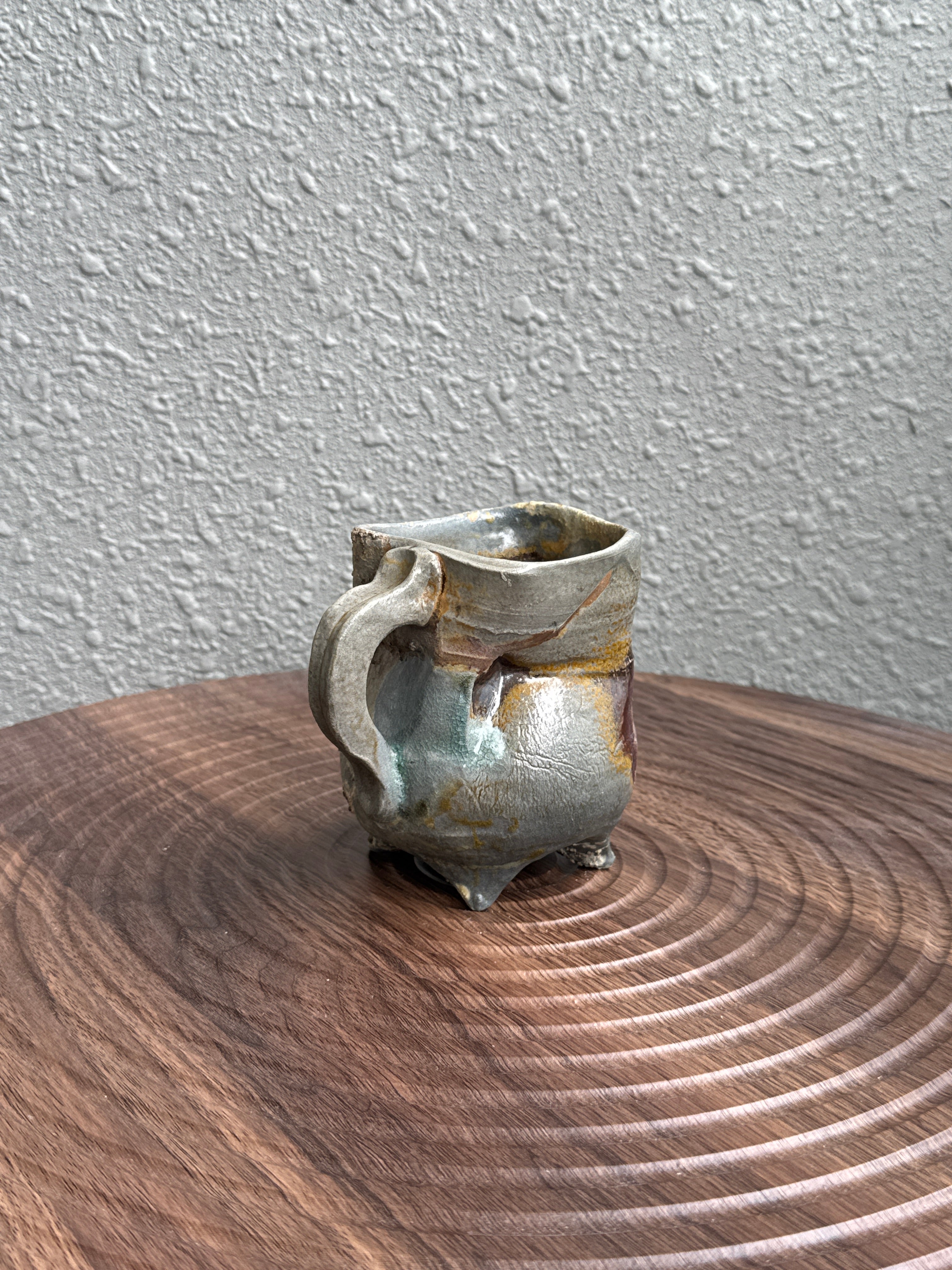 Detail of flame marks and ash deposit on a woodfired stoneware mug, Bali