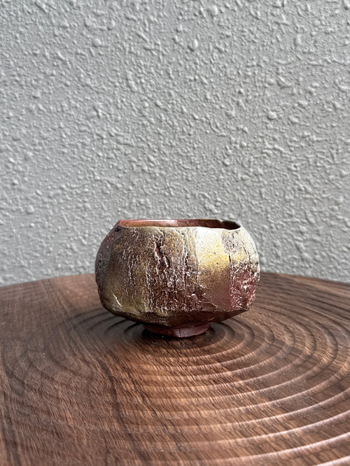 Detail of carved surface on a kurinuki tea bowl, woodfired in Bali