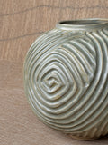 Wheel-thrown stoneware vase with hand-carved spiral grooves and pale sage glaze, Ripples collection, Singapore