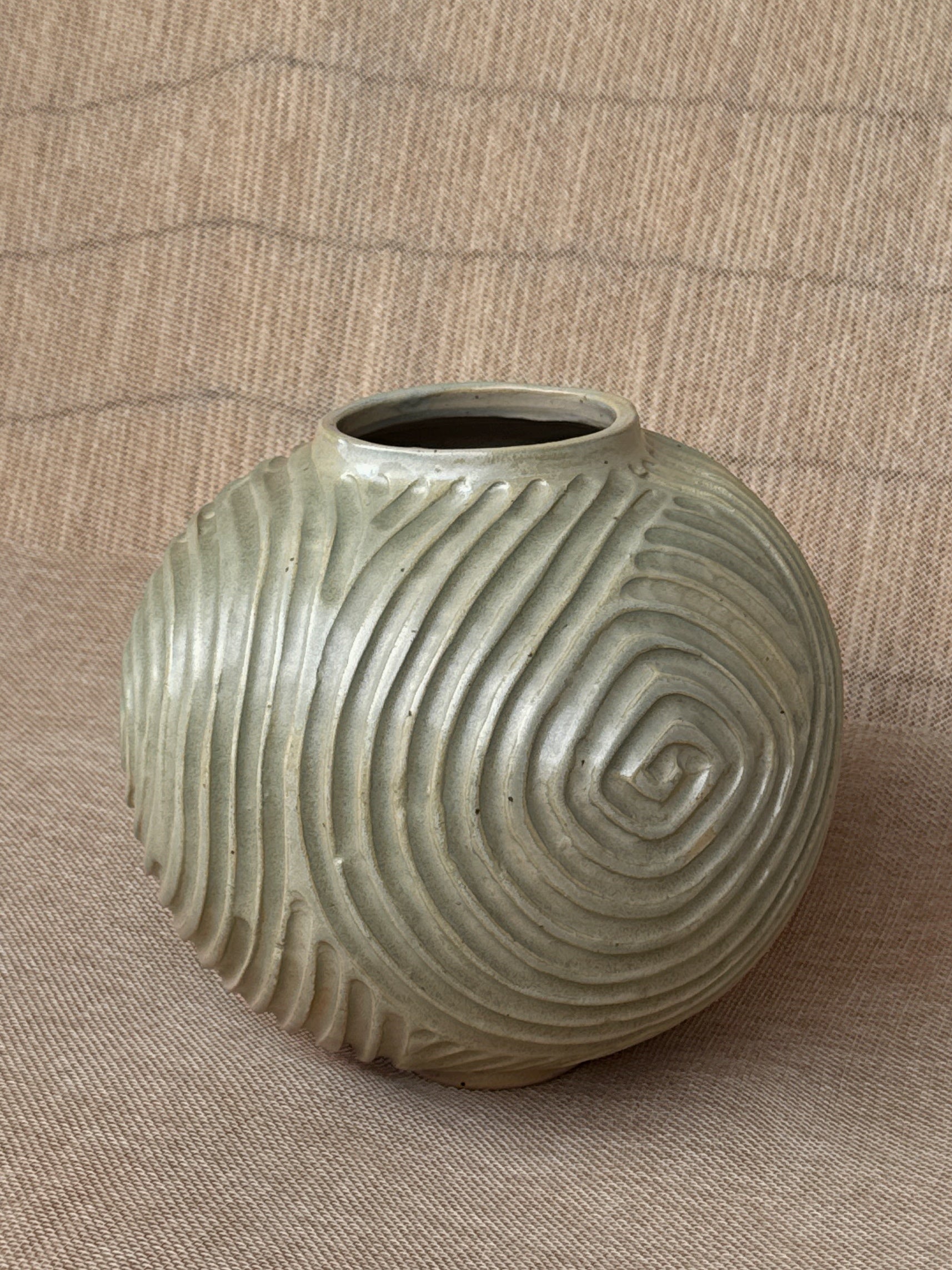 Detail of carved spiral texture and glaze on a stoneware Ripples vase