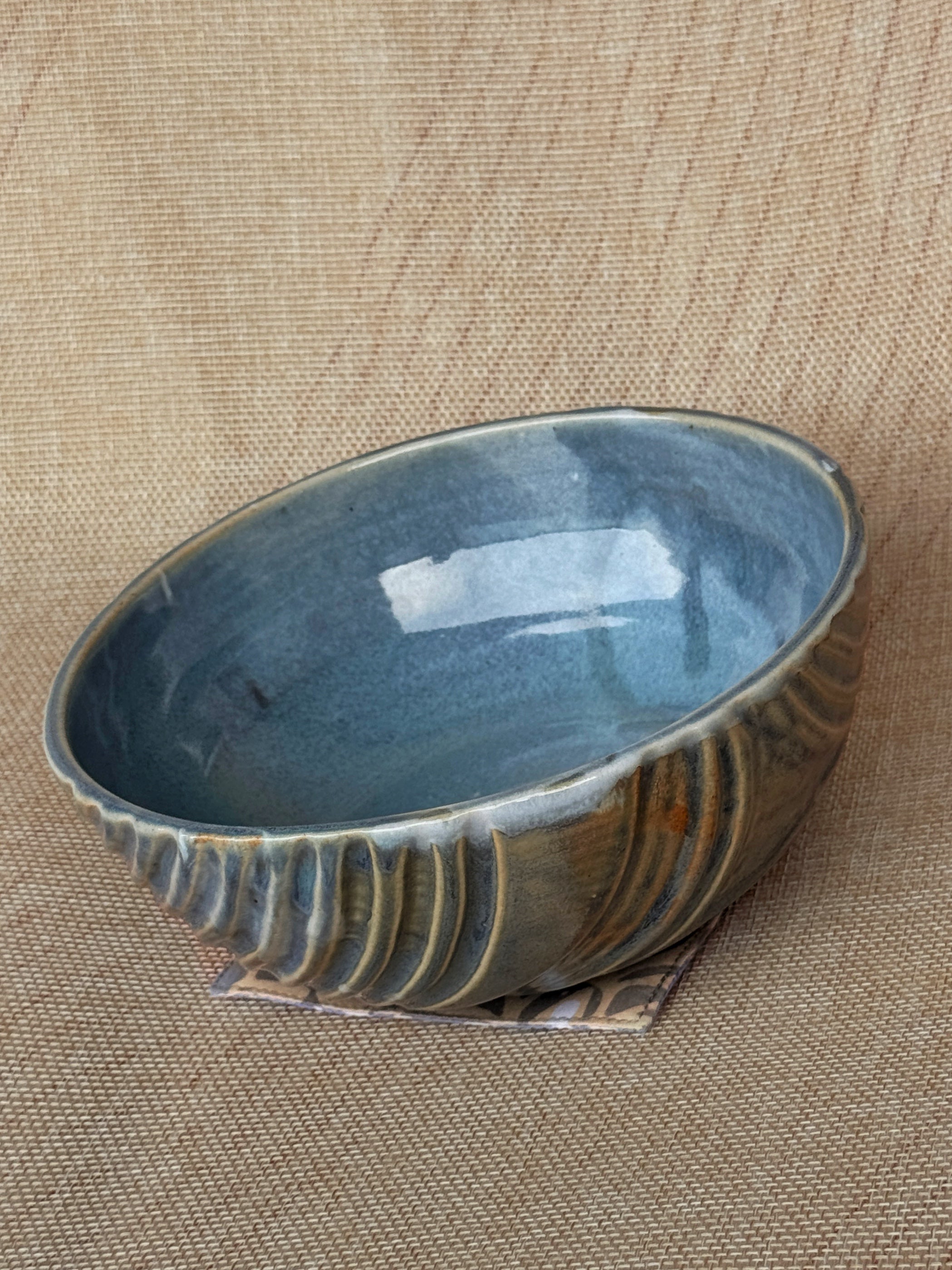 Oval stoneware bowl with fluted carved lines and blue-grey glaze, Ripples collection