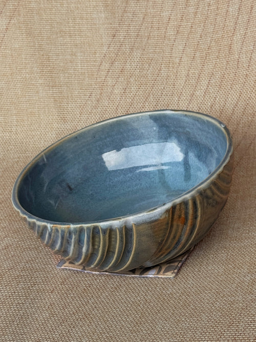 Oval stoneware bowl with fluted carved lines and blue-grey glaze, Ripples collection