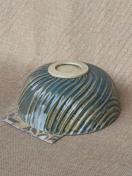 Detail of fluted carving and glaze break on a Ripples stoneware bowl
