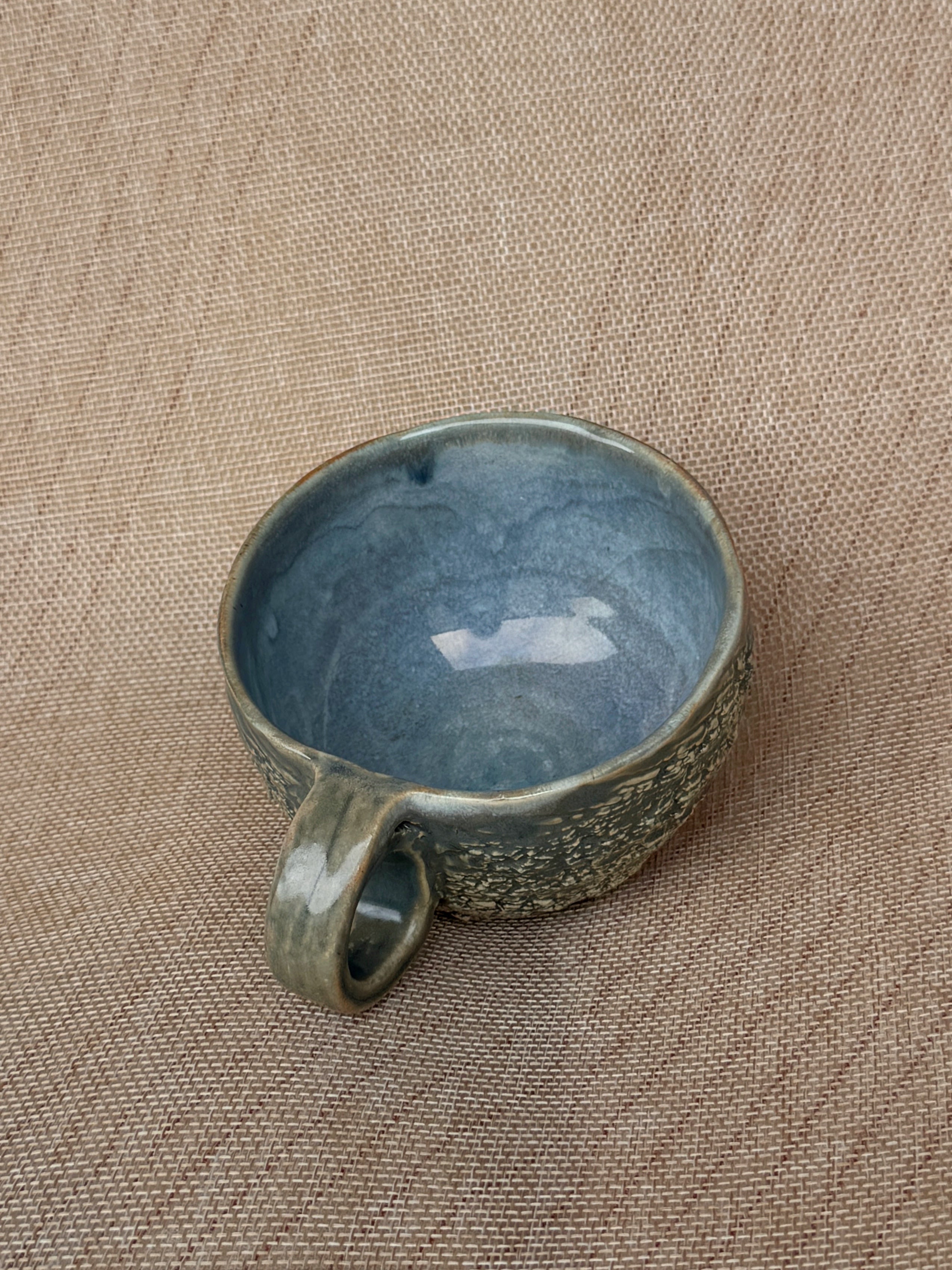 Detail of cratered texture on a stoneware Ripples cup