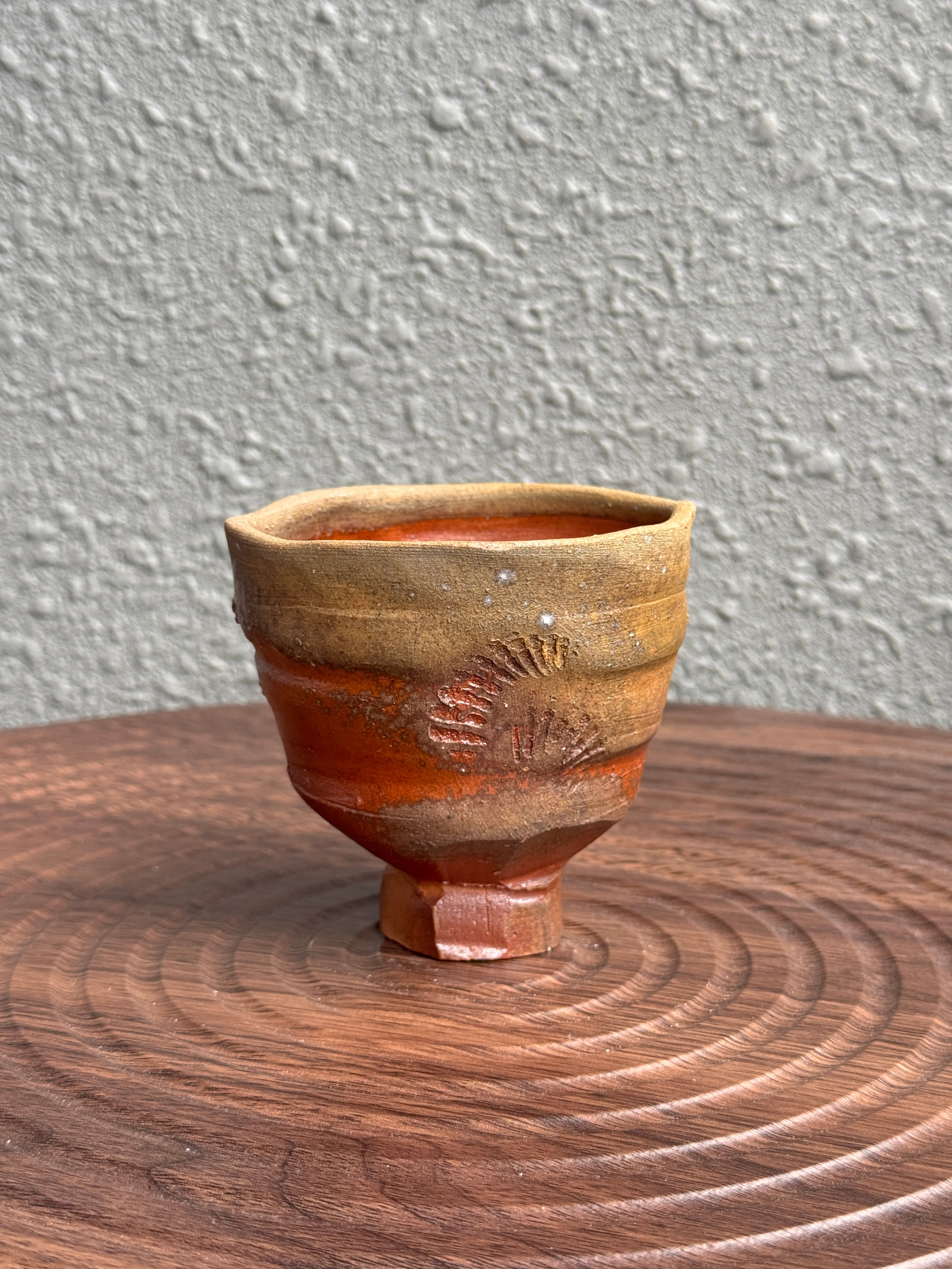 Detail of shell impressions on a woodfired yunomi cup, Bali