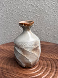 Tall faceted stoneware bottle with a structural twist, woodfired in Bali, Ubud Forest