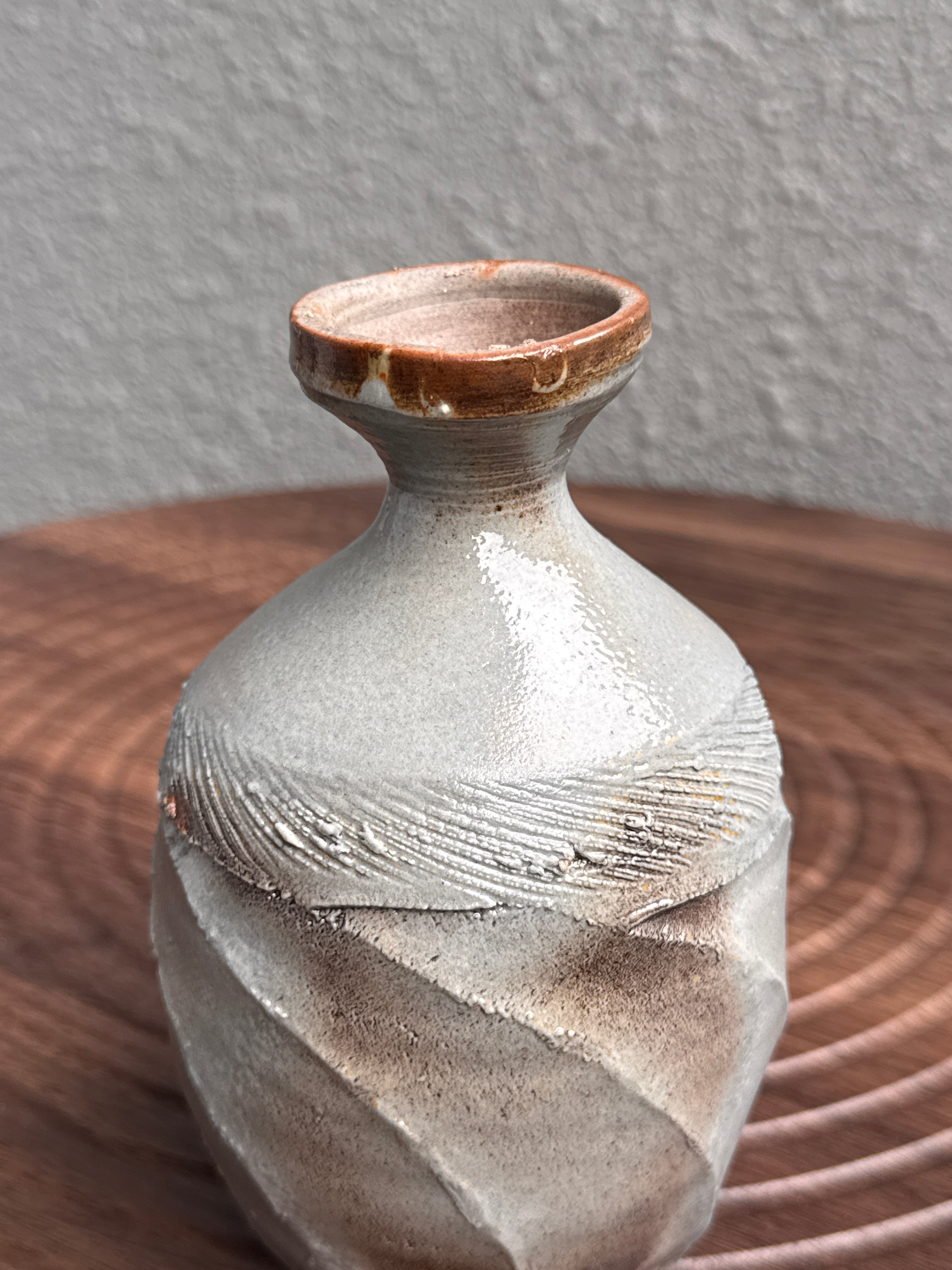 Detail of the twisted form on a woodfired stoneware bottle, Ubud Forest