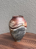 Small woodfired stoneware bottle with iron-dark surface and porcelain slip marks, Ubud Forest