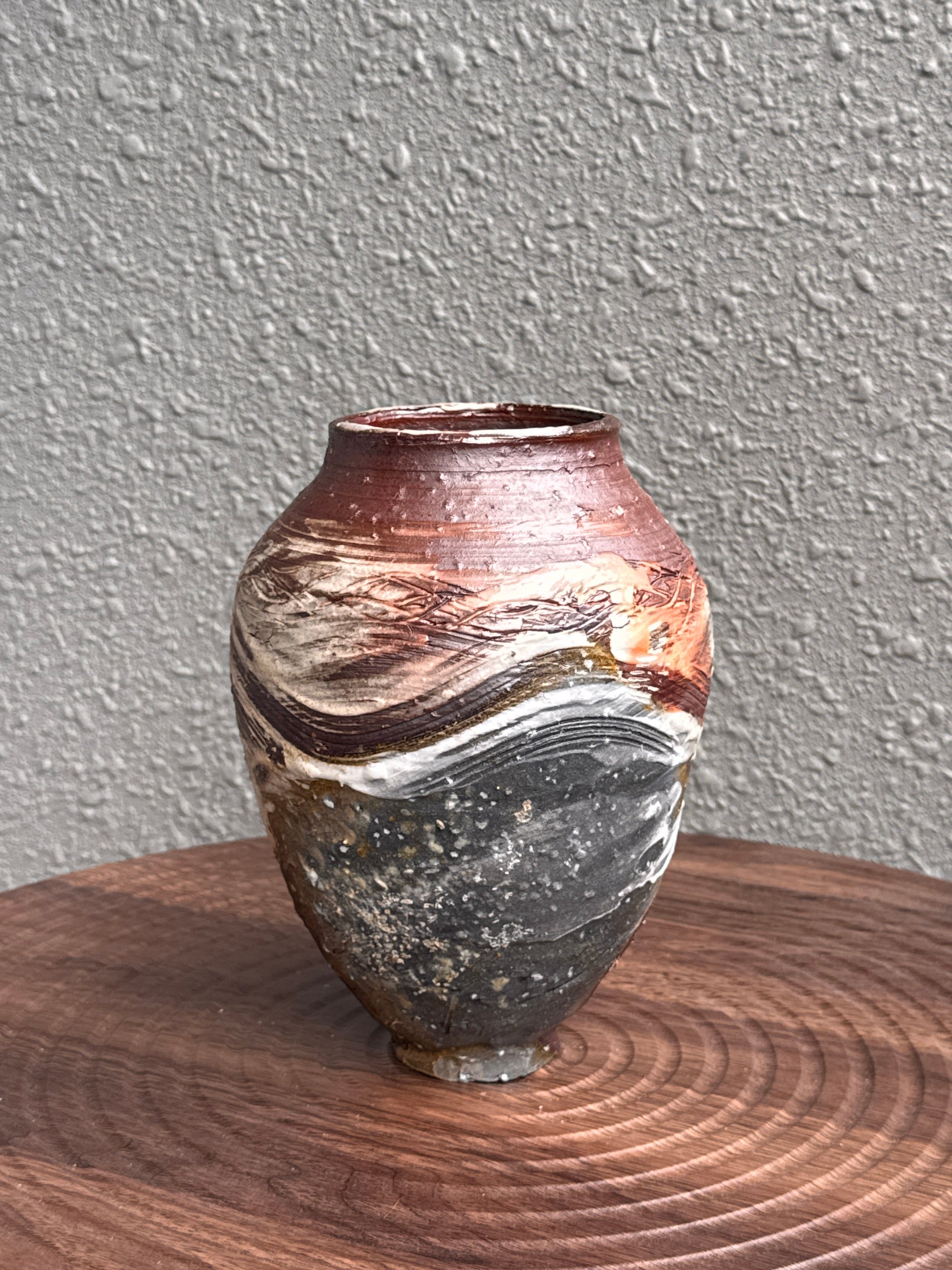 Small woodfired stoneware bottle with iron-dark surface and porcelain slip marks, Ubud Forest