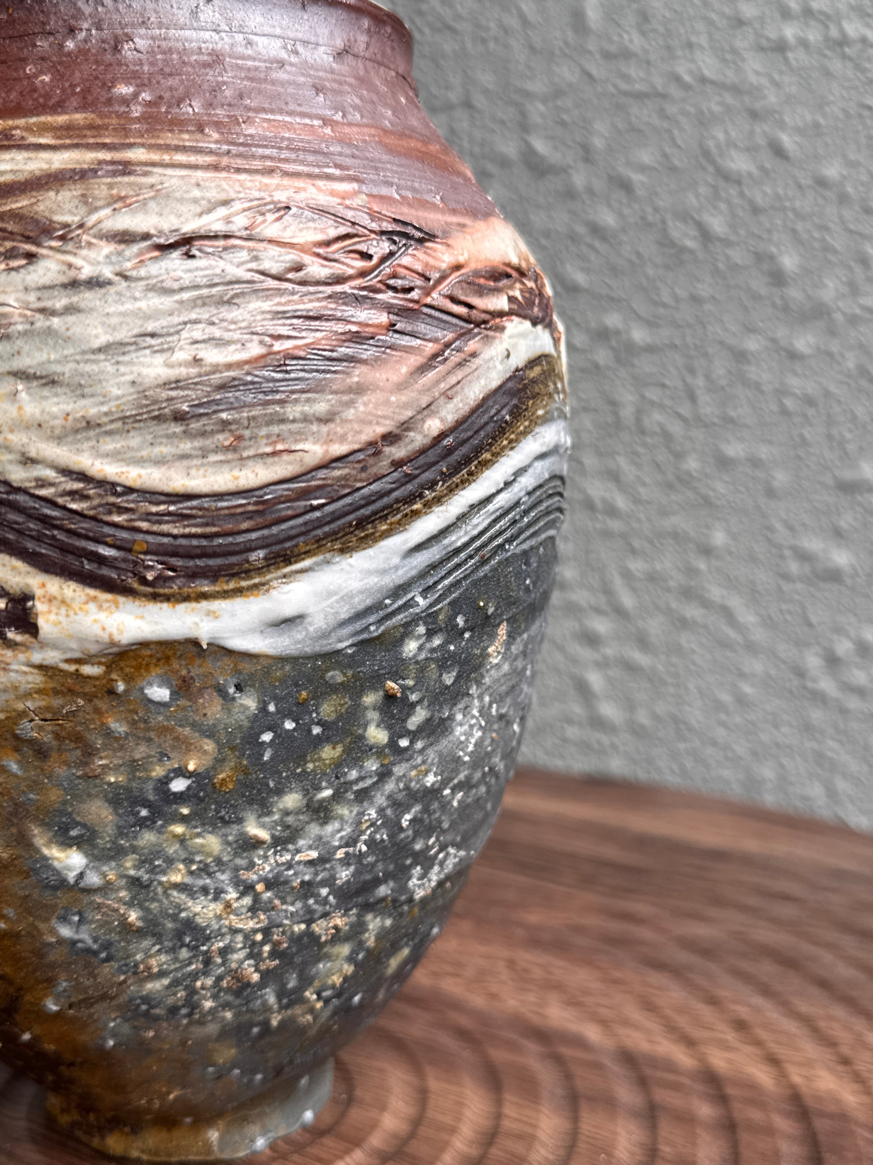 Detail of porcelain slip marks on a woodfired stoneware vessel, Ubud Forest