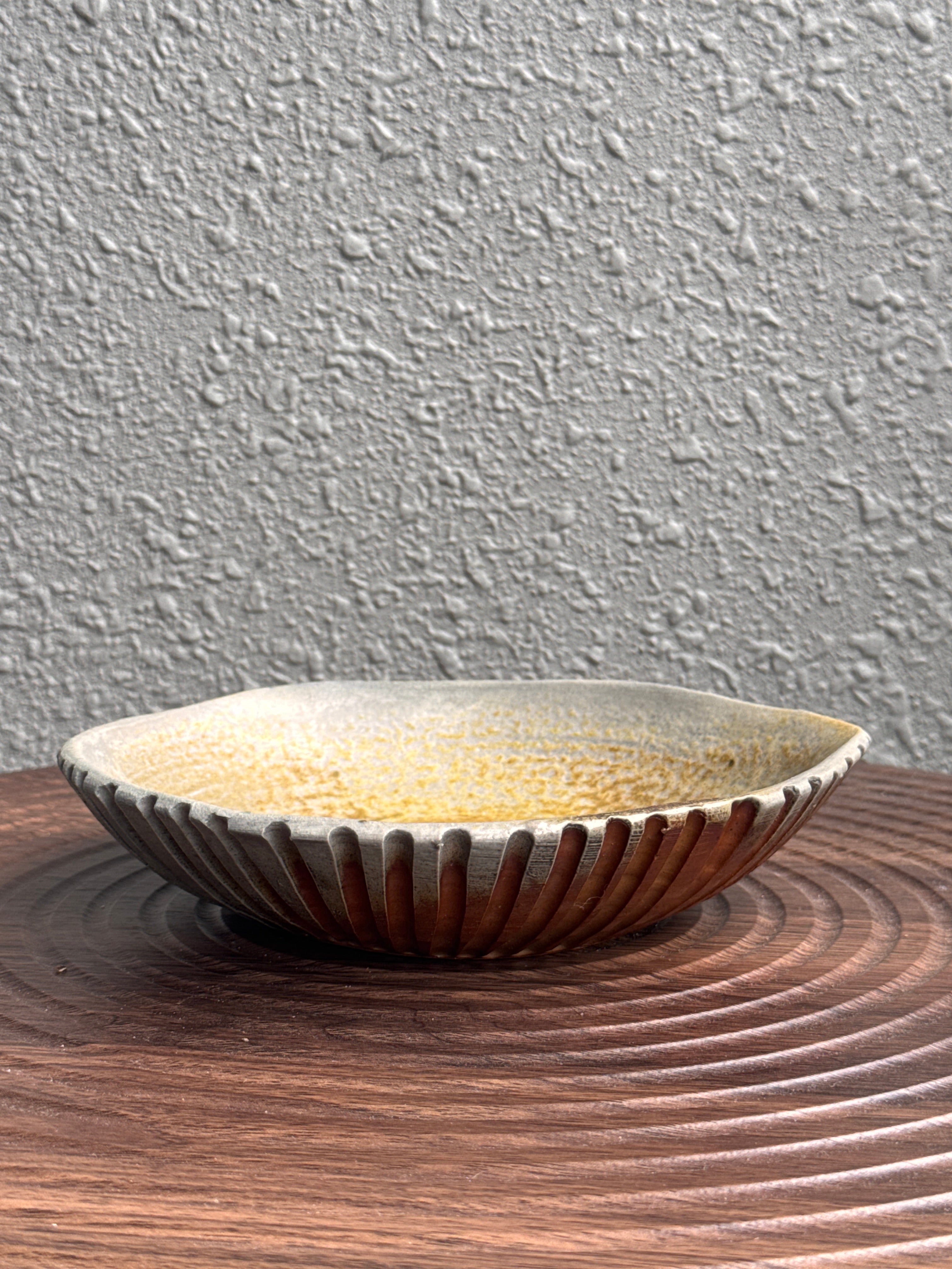 Woodfired triangular stoneware plate viewed from above, Ubud Forest