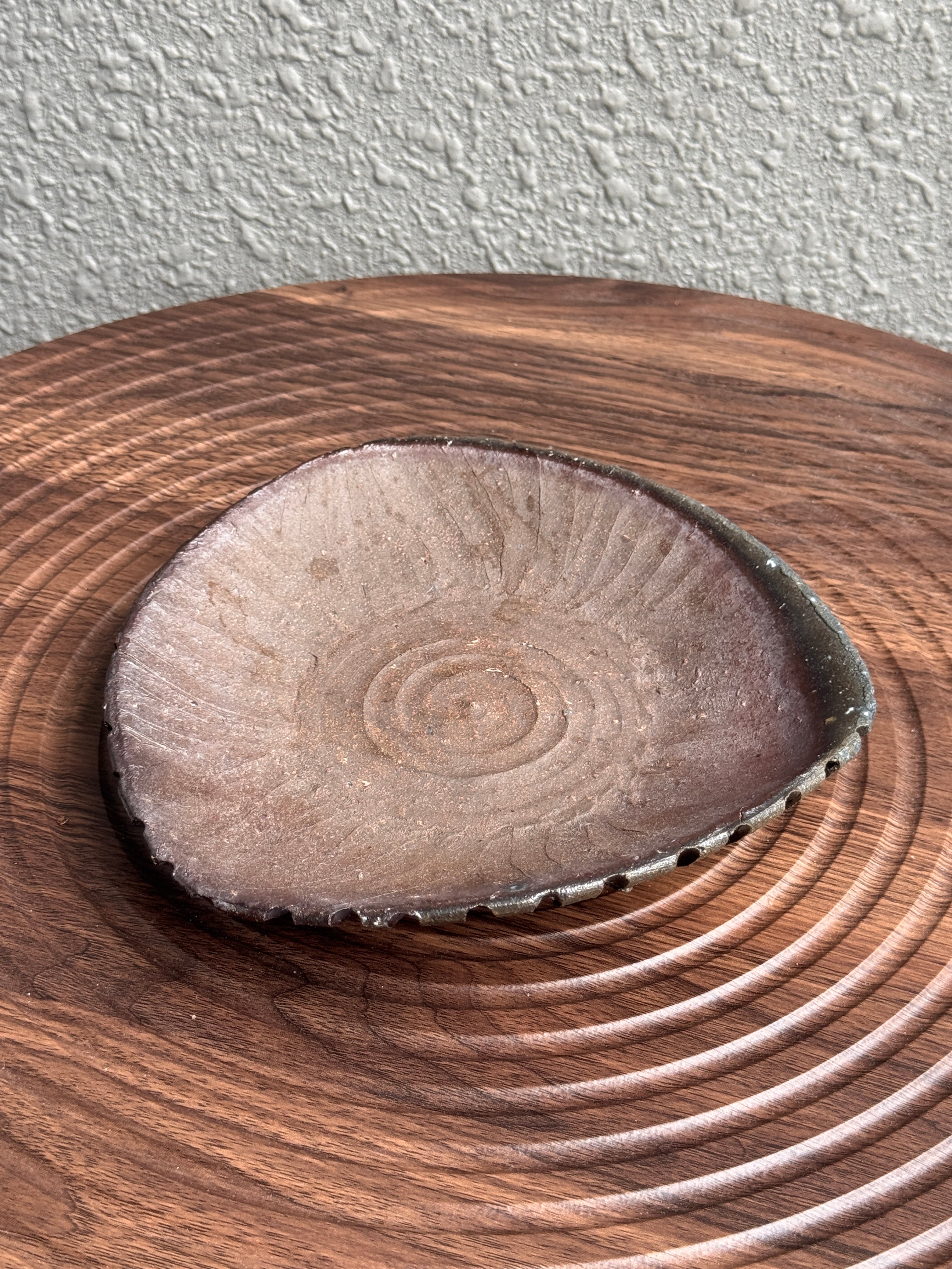 Small triangular woodfired stoneware dish with ash deposits, Ubud Forest