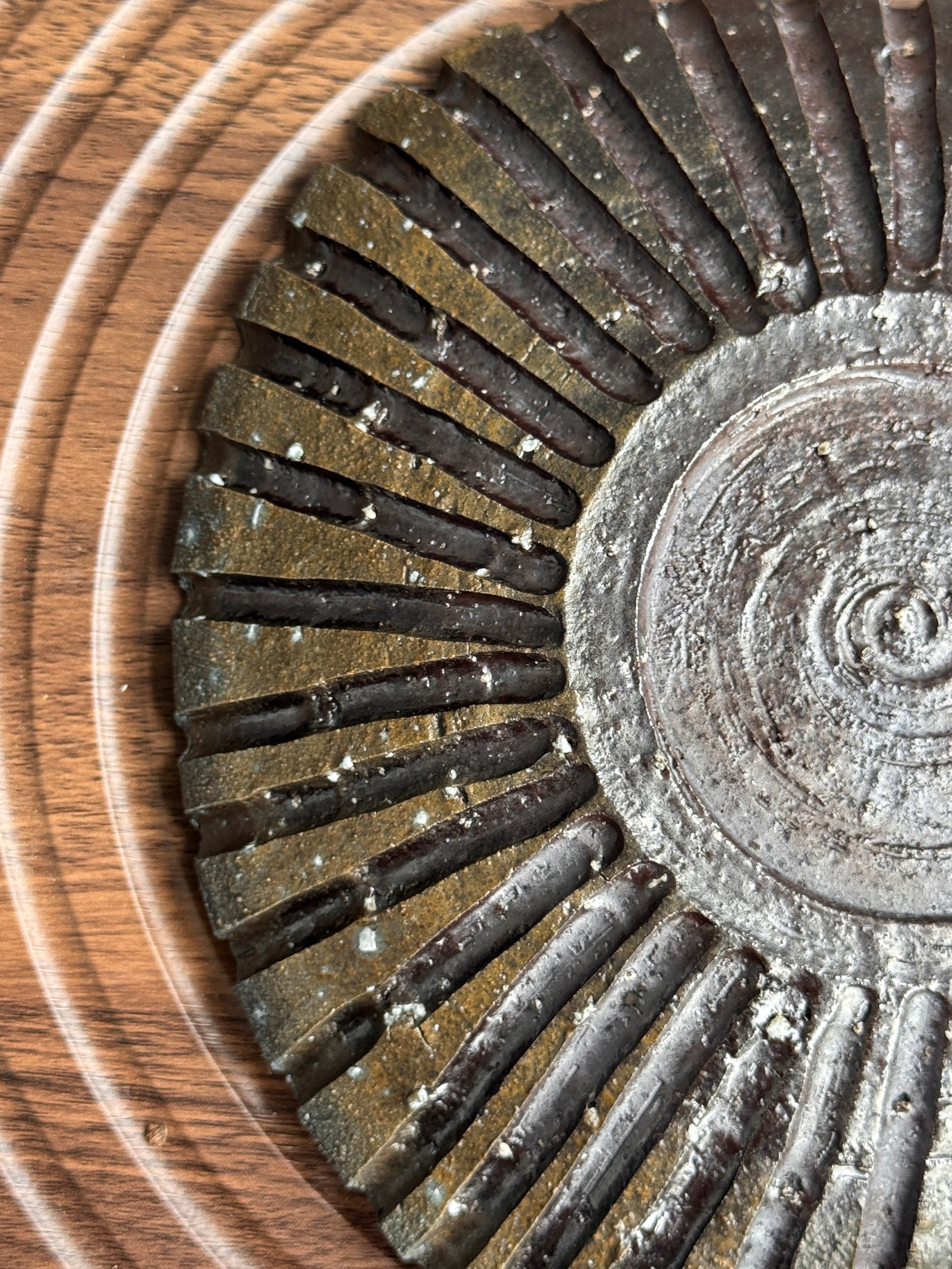 Detail of ash gradient on a woodfired triangular dish, Ubud Forest