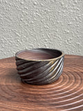 Small ribbed woodfired yunomi bowl with golden amber glaze, Ubud Forest