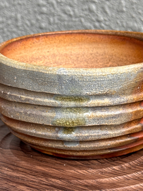 Detail of throwing rings and ash surface on a woodfired yunomi bowl, Ubud Forest