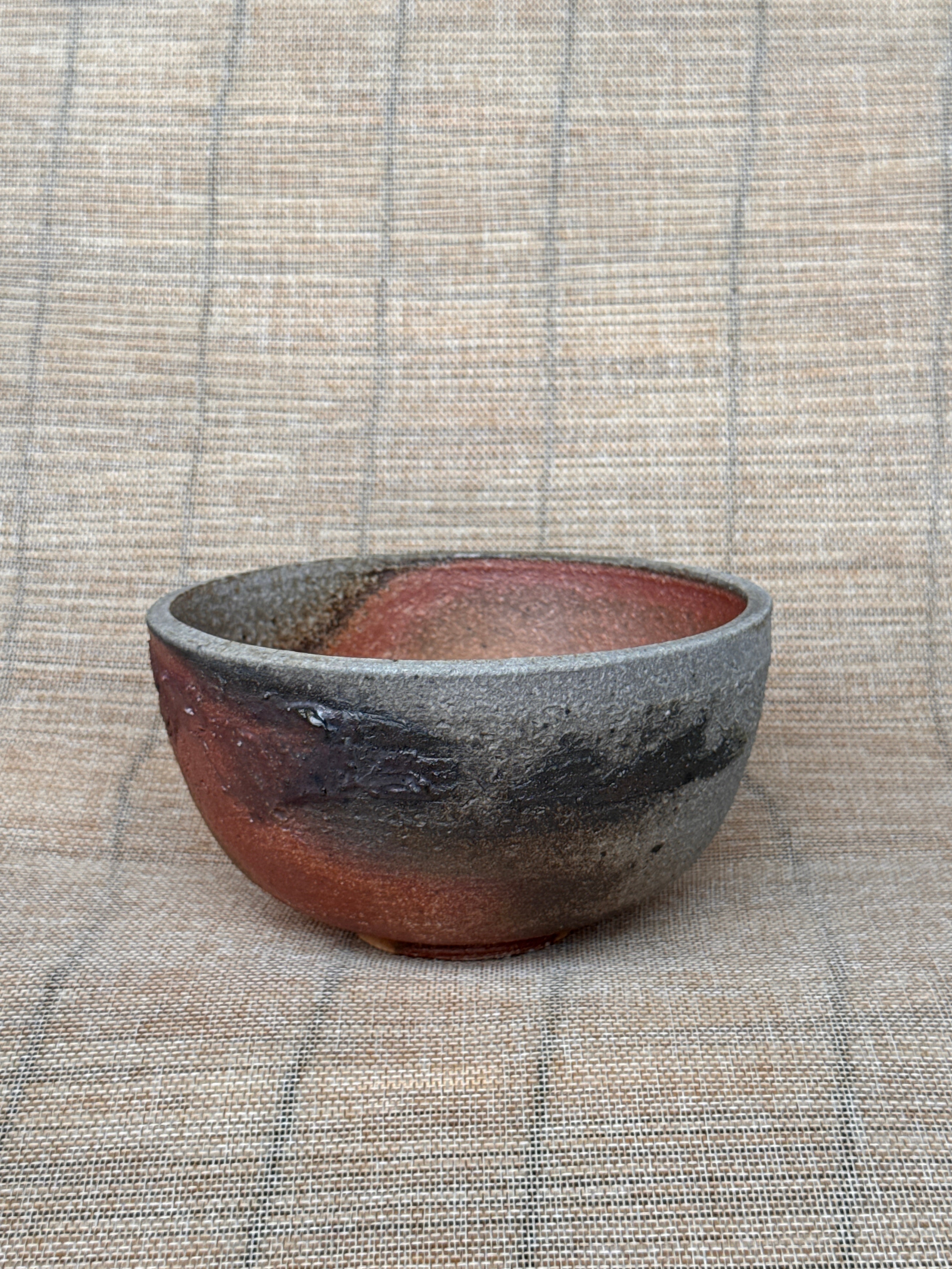 Detail of multicolored ash surface on a woodfired stoneware bowl, Tokoname