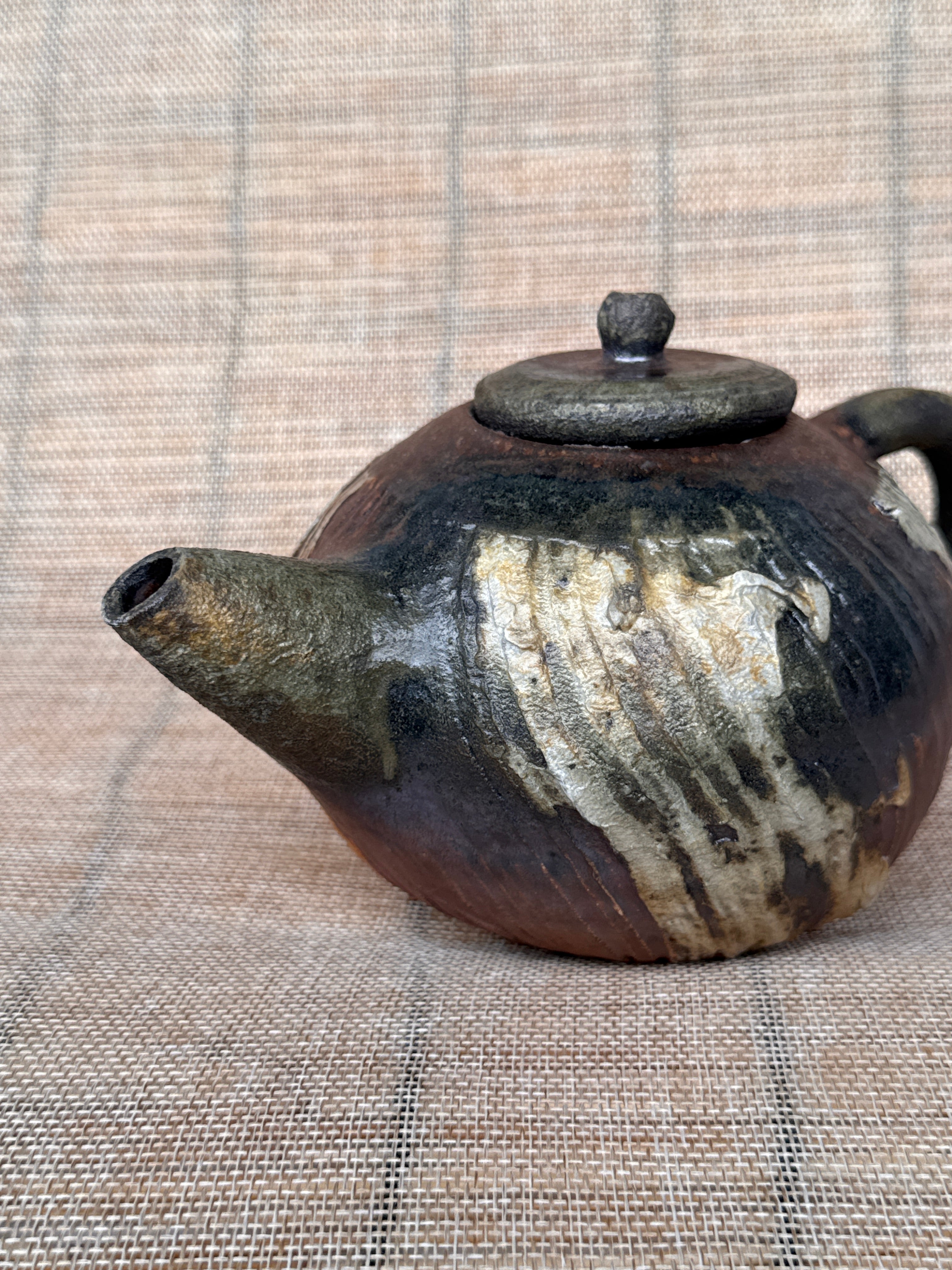 Detail of surface texture on a small woodfired stoneware teapot, Tokoname